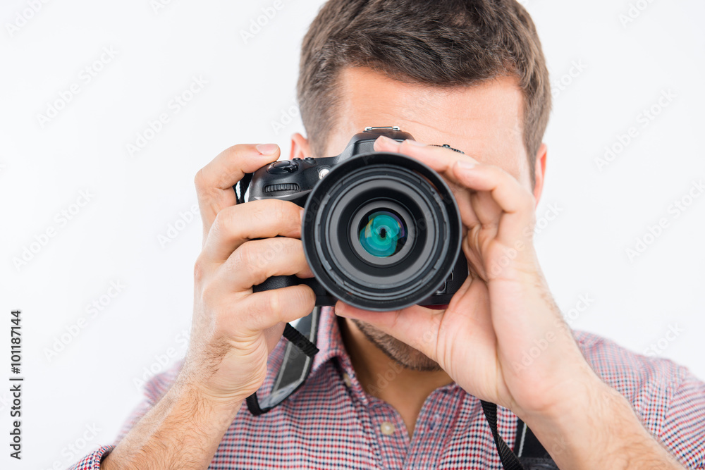 Close up portrait of young photographer taking photo Close up portrait of young photographer taking photo