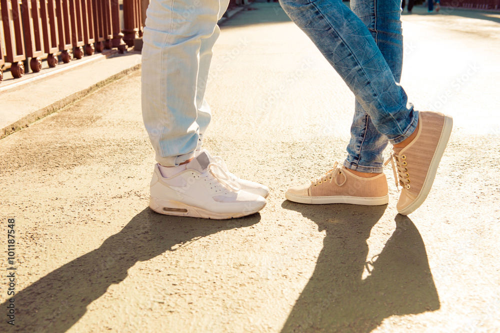 Closeup photo of couple in love on the bridge standing together Closeup photo of couple in love on the bridge standing together