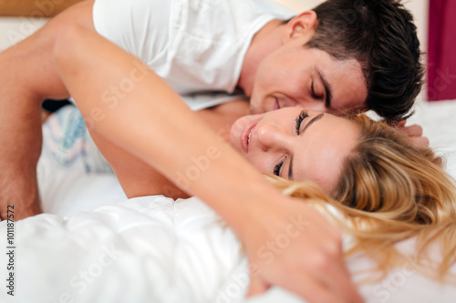 Couple in love lying on bed