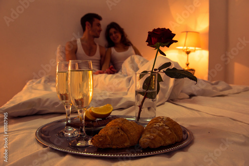 Couple in love having romantic supper in bedroom
