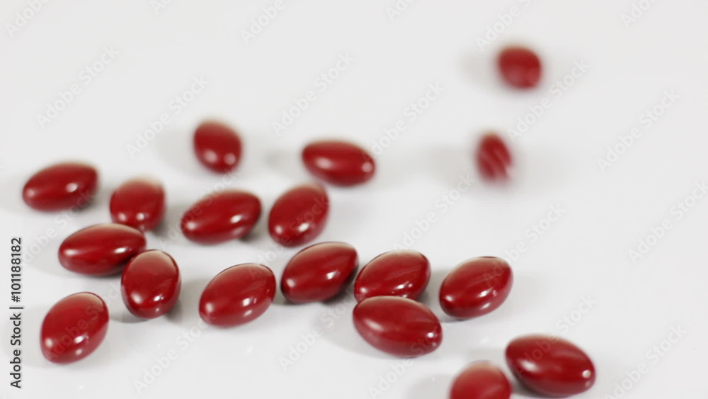 Red pills falling on white background, Multi shot
Red pills falling on white background, Multi shot