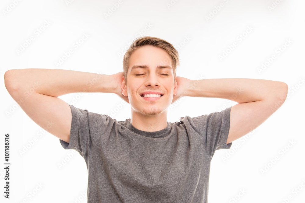 Cheerful man dreaming and holding hands behind head Cheerful man dreaming and holding hands behind head