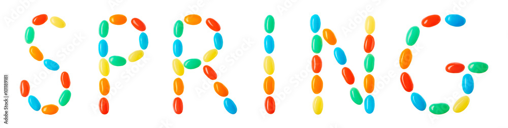 spring lettering made of multicolored candies isolated on white