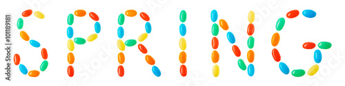 spring lettering made of multicolored candies isolated on white