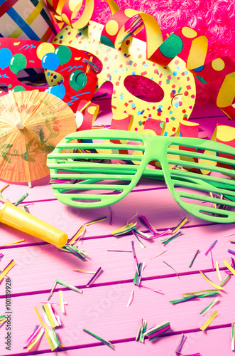 Colorful party decoration on pink background