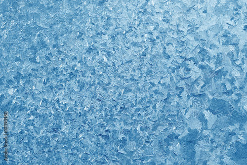 Frost patterns on window glass in winter. Frosted Glass Texture. Blue