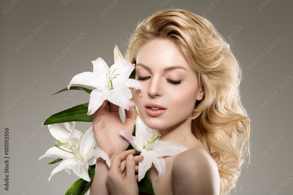 Beauty face woman, flowers, lily. Girl healthy model in spa salo