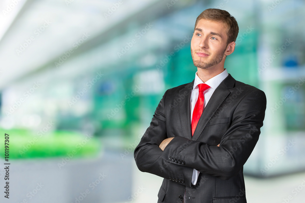 Young handsome Businessman with his arms crossed Young handsome Businessman with his arms crossed
