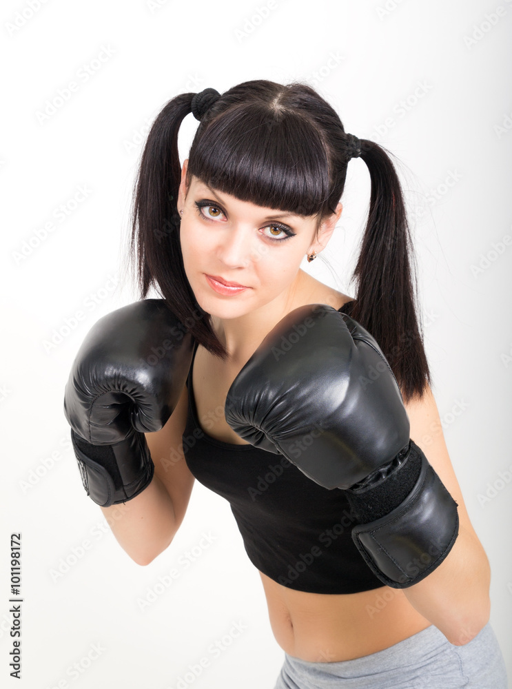 female boxer, fitness woman boxing wearing boxing black gloves