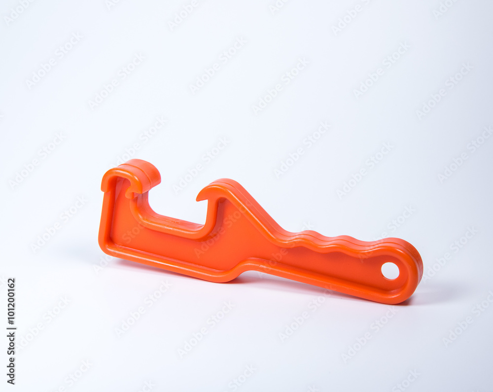 orrange plastic pail opener on white background.-bucket opener. orrange plastic pail opener on white background.-bucket opener.