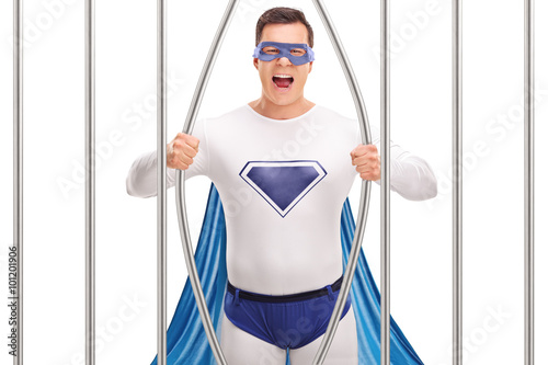 Young superhero breaking out of prison