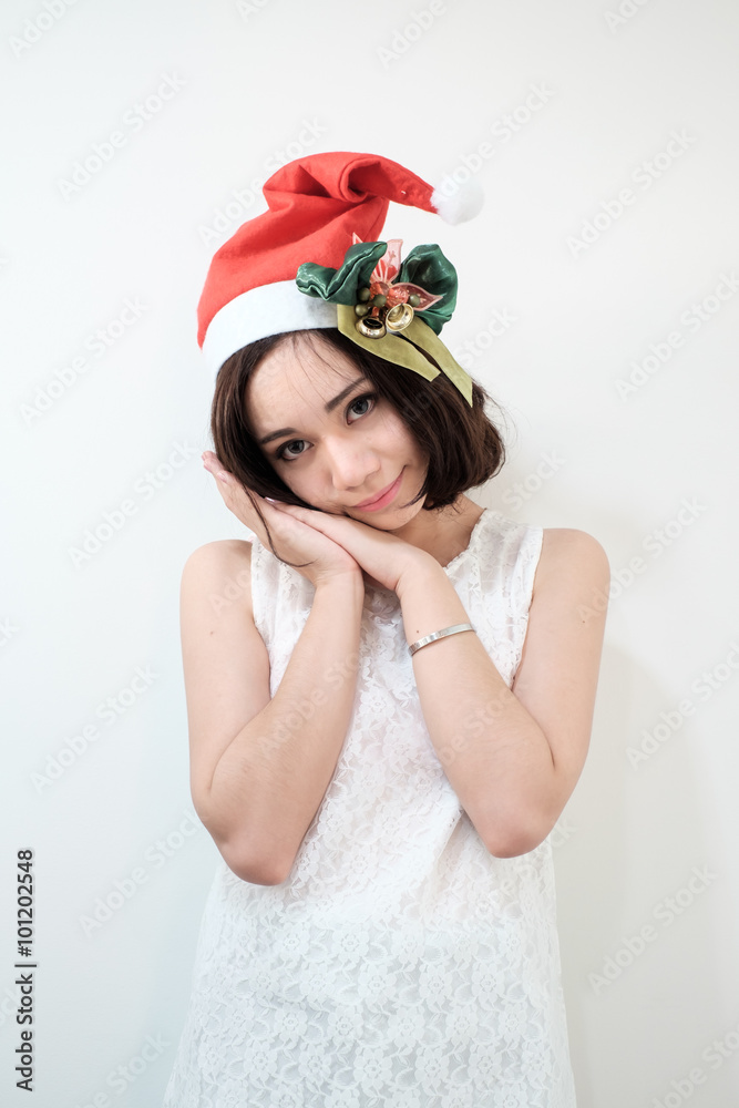 Happy Asian woman waering santa hat Happy Asian woman waering santa hat