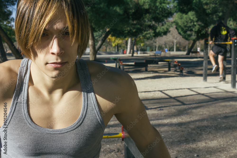 Man resting during a street workout Man resting during a street workout