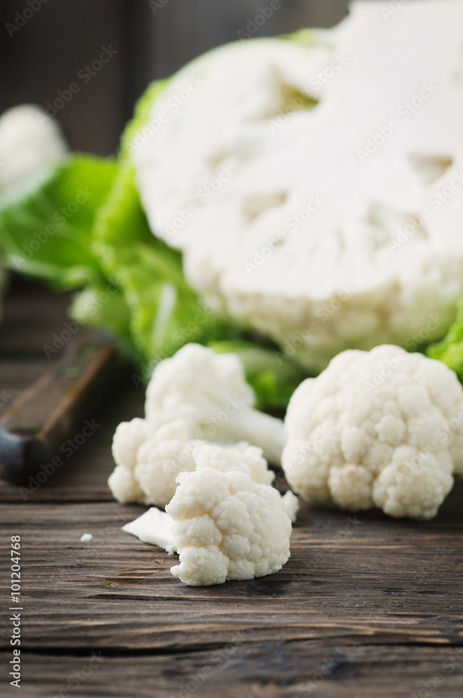 Fresh raw cauliflower on the wooden table Fresh raw cauliflower on the wooden table