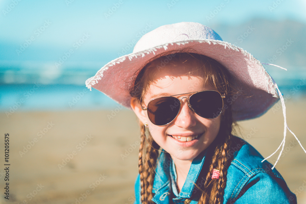 little girl in a hat on the beach little girl in a hat on the beach