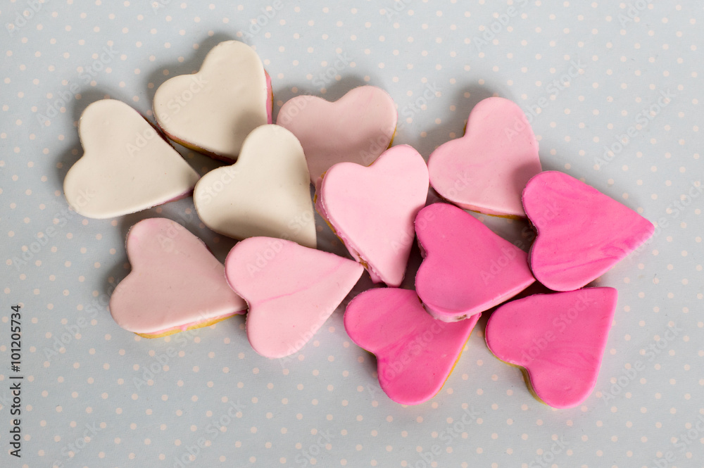 Fototapeta premium Pink cookies, heart shape, blue background