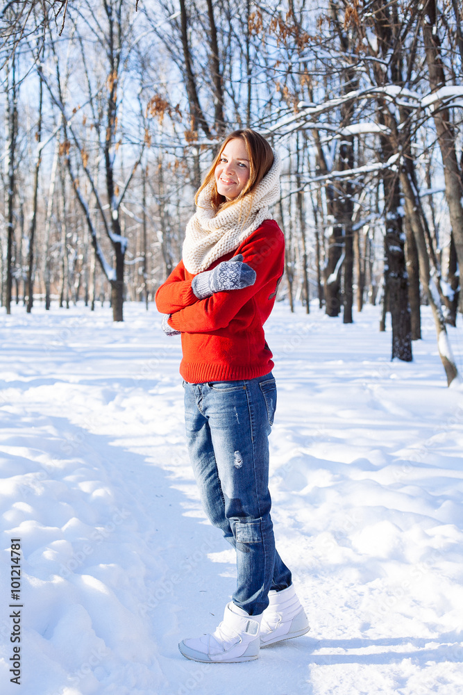 Beautiful winter portrait of young woman in red sweater Beautiful winter portrait of young woman in red sweater