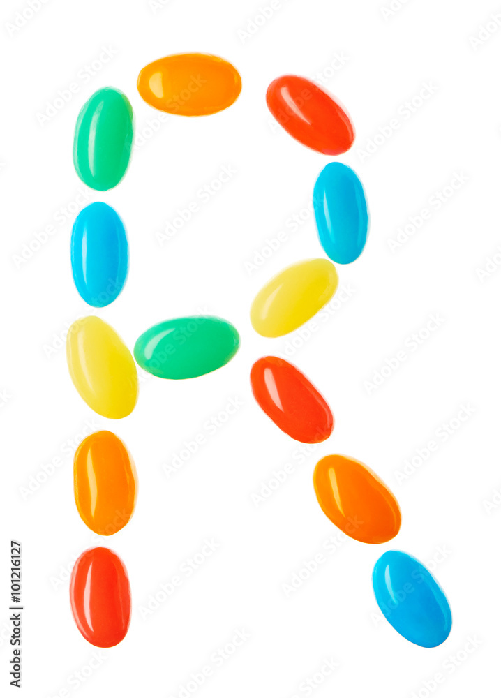 R letter made of multicolored candies isolated on white
