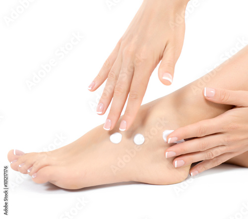 Woman apply the ointment on legs. Depilation or another woman legs healths concept © Glebstock