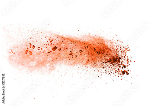 Explosion of orange powder on white background
