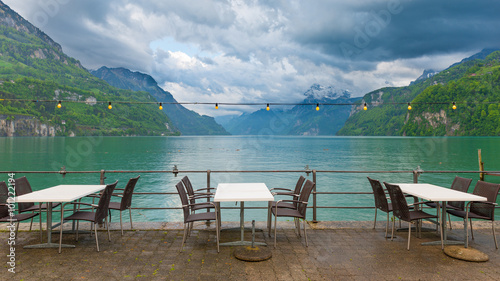 Town of Brunnen in central Switzerland. Cafe on the lake. Chairs and desks.