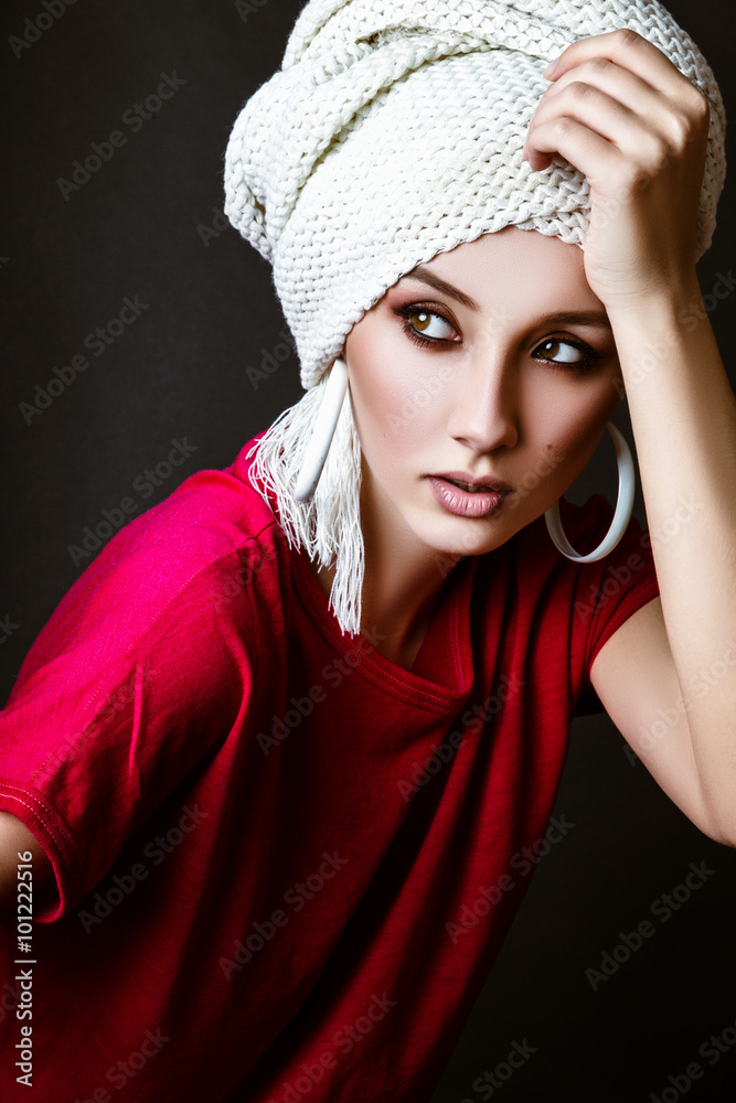 Studio photo of young woman on black background. Studio photo of young woman on black background.