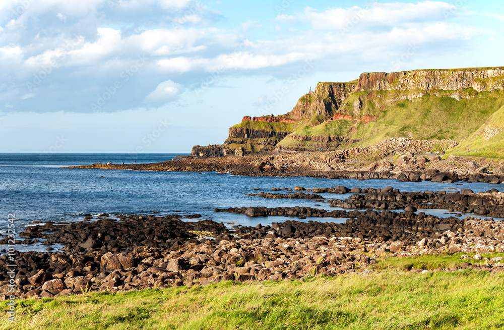 Giants Causeway, unique geological formation of rocks and cliffs in Antrim County, Northern Ireland, in sunset light