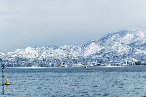 Landscape black sea on background snow mountains of Georgia
