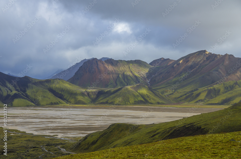 Lake and moss-covered volcanic mountains. Landmannalaugar. Iceland