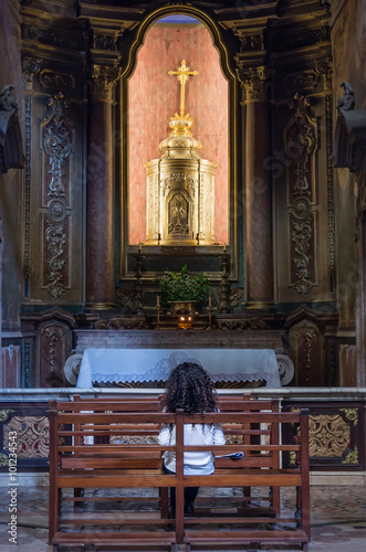 Little girl praying in church