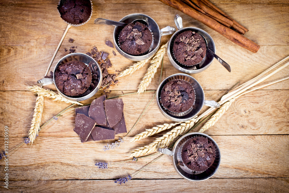 Chocolate muffins in silver cup on table Chocolate muffins in silver cup on table