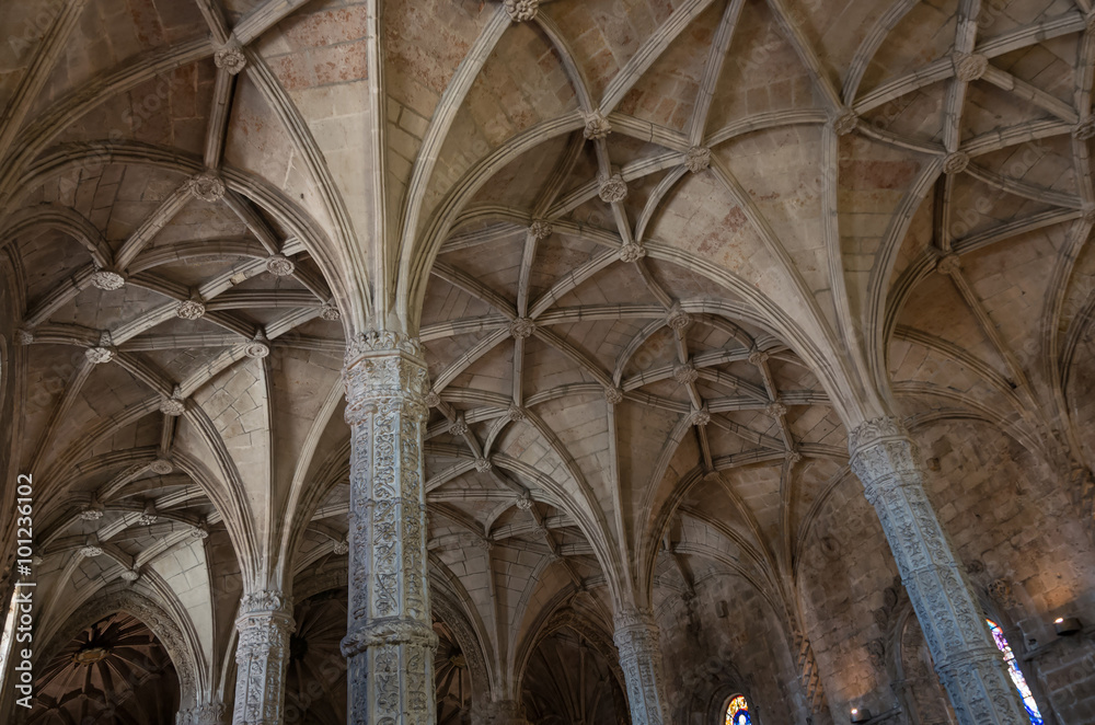 Columns and vaulted ceiling in manuelino style Jeronimos church. Lisbon, Portugal