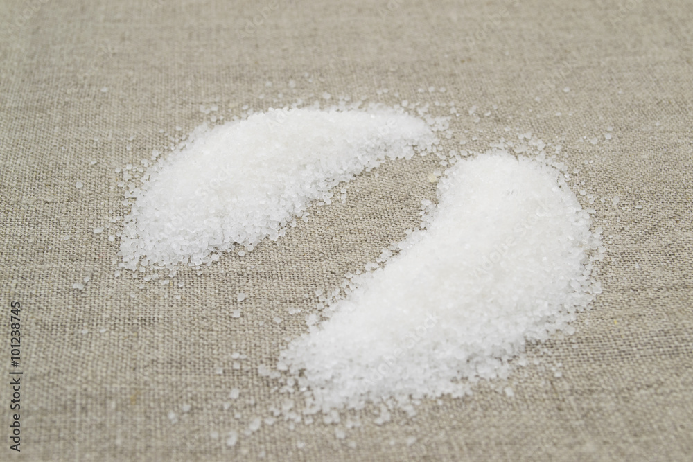 Loose sugar on a gray fabric
Loose sugar on a gray fabric
