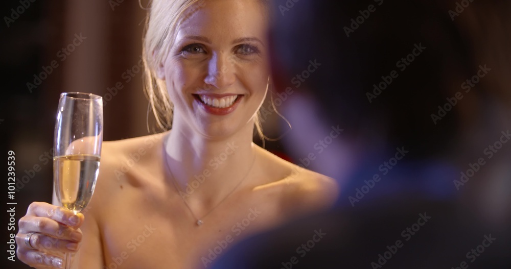 Elegant woman have dinner toast with her boyfriend at the restaurant in the evening in slow motion (in realtime at 60 fps) Elegant woman have dinner toast with her boyfriend at the restaurant in the evening in slow motion (in realtime at 60 fps)