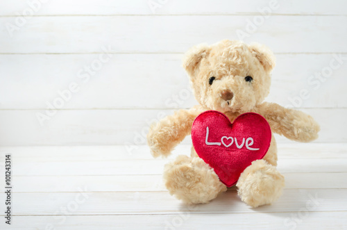 Brown Teddy Bear holding red heart