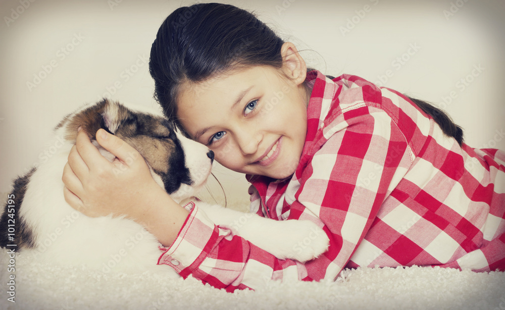 little girl hugging a puppy little girl hugging a puppy