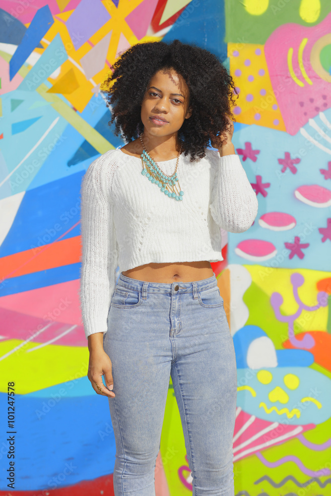 Fototapeta premium Woman posing in a sweater and jeans