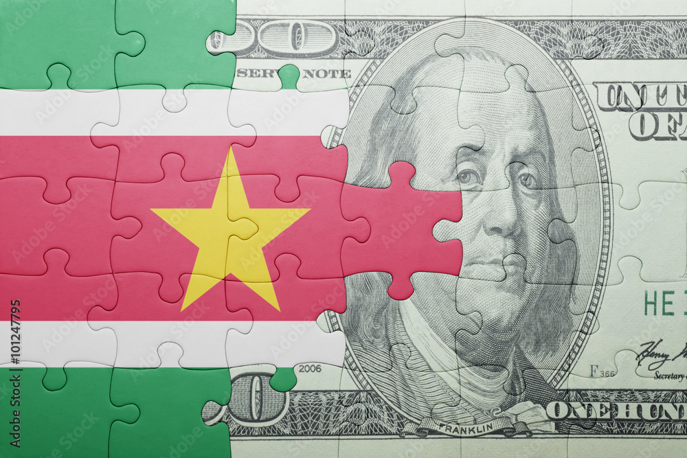 puzzle with the national flag of suriname and dollar banknote