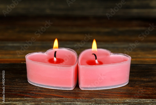 Burning candles in the shape of a heart