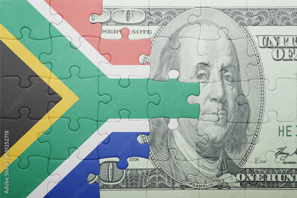 puzzle with the national flag of south africa and dollar banknote