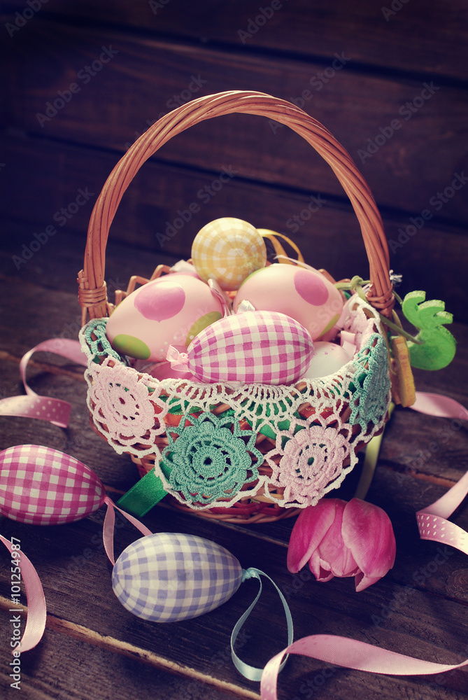 wicker basket with colorful eggs for easter