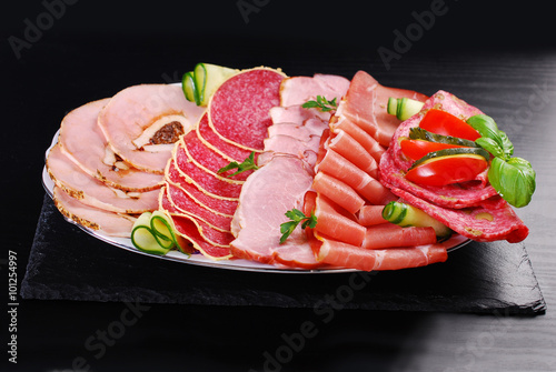platter of sliced ham,salami and cured meat