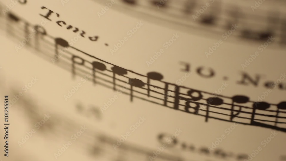 Sheet music rolling dynamic light shallow depth of field Sheet music rolling dynamic light shallow depth of field