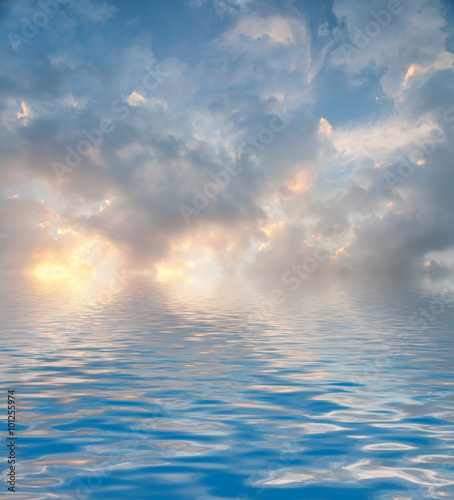 Surface Rippled of water with clouds and sky background