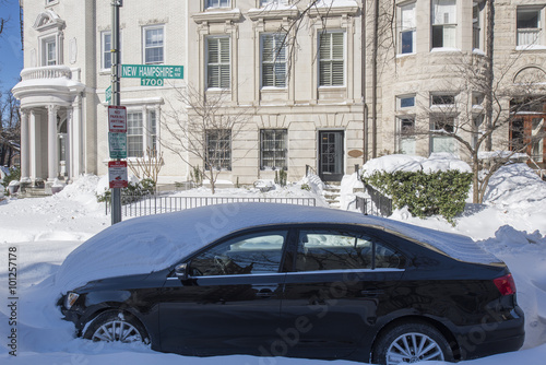 Snow covered streets and cars