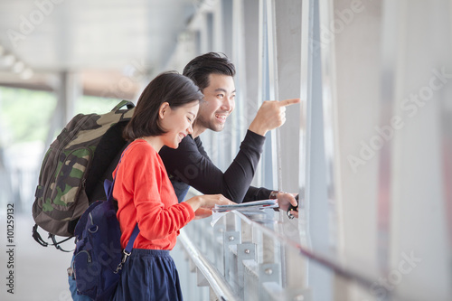 asian younger man and woman traveling 