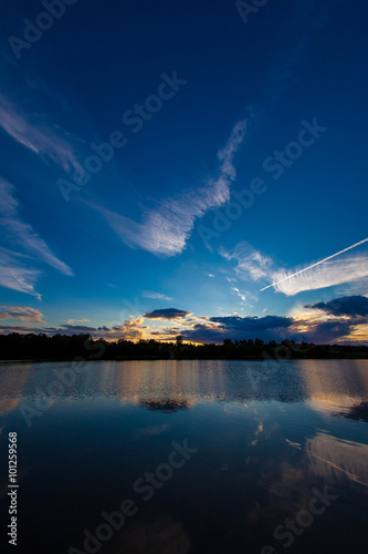 Fototapeta Naklejka Na Ścianę i Meble -  blue evening sky and smooth water surface