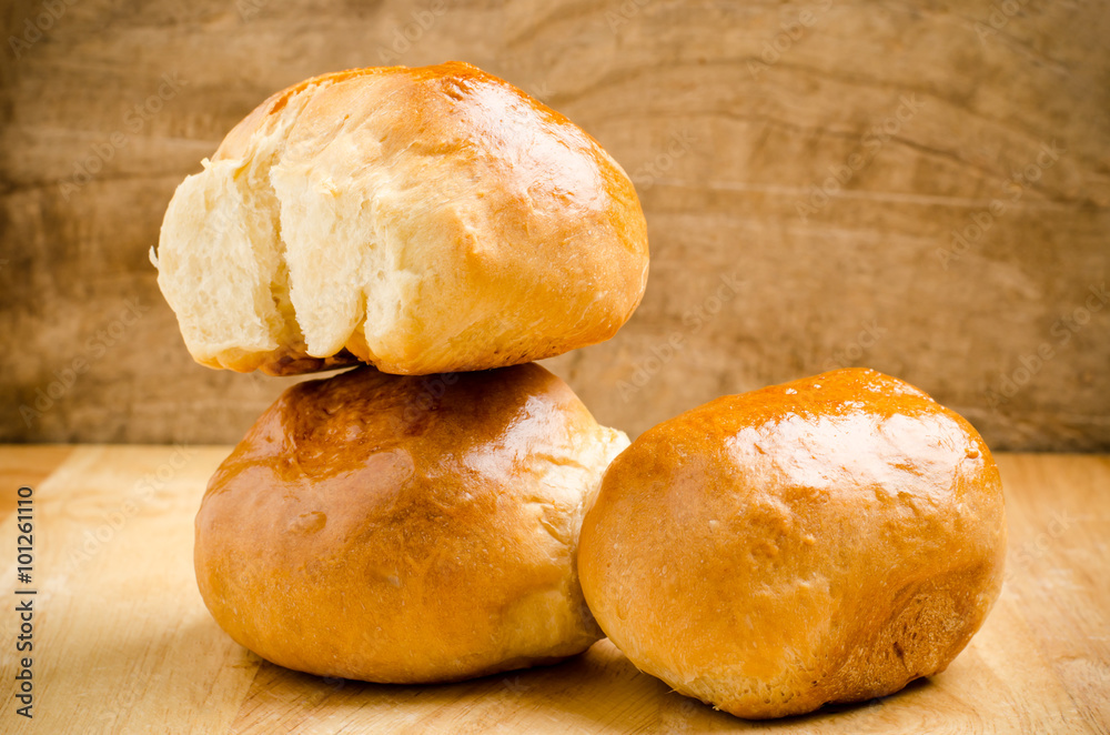 Fresh bun on wooden background,homemade bakery Fresh bun on wooden background,homemade bakery
