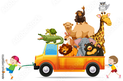 Children pulling a truck loaded with wild animals