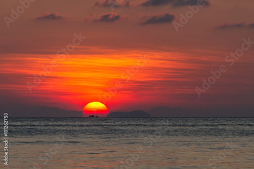 Fototapeta Naklejka Na Ścianę i Meble -  Silhouettes of fisherman and a ship on the background at sunset on Koh Samui, Thailand
